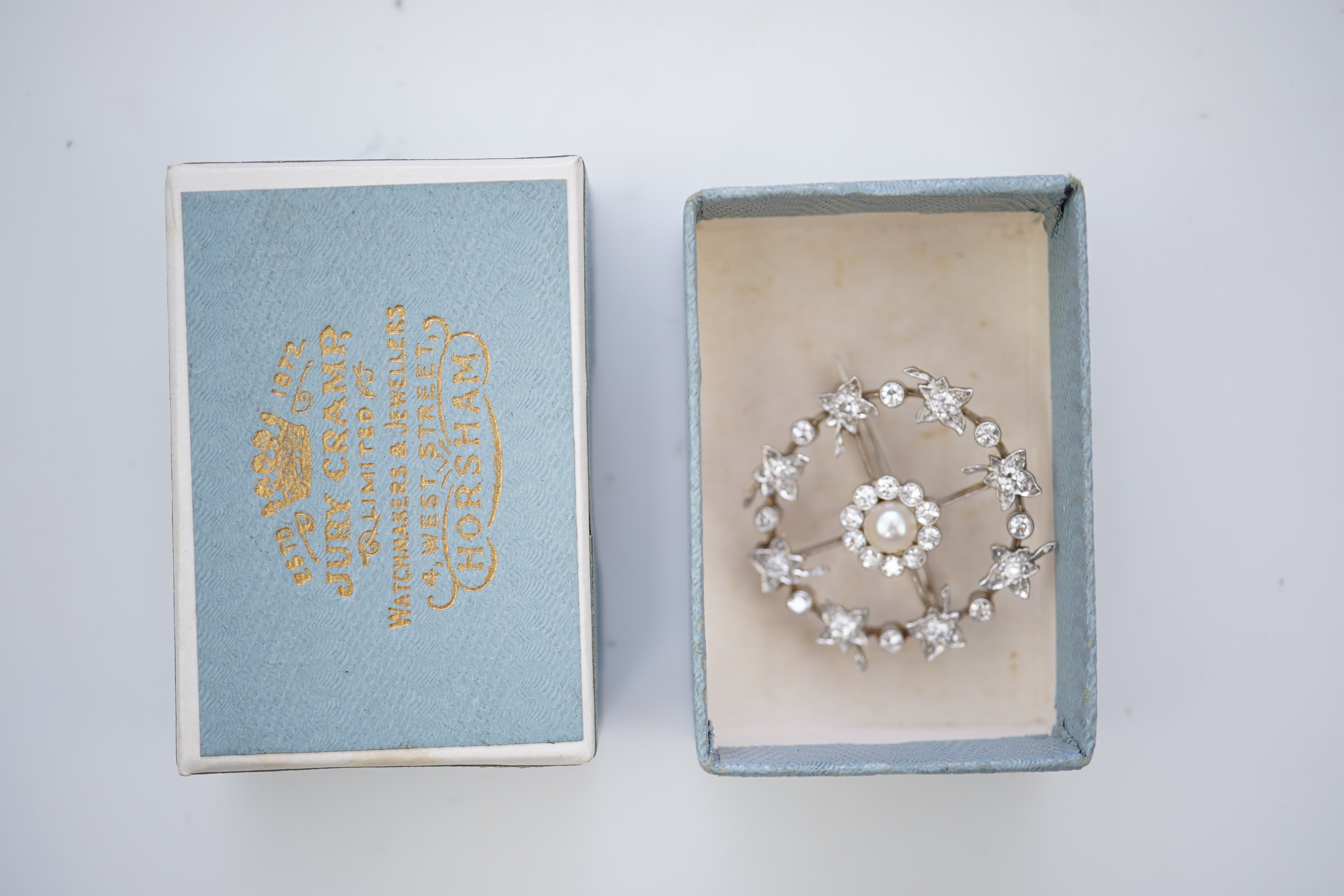 An attractive Edwardian pearl and diamond brooch, circa 1910